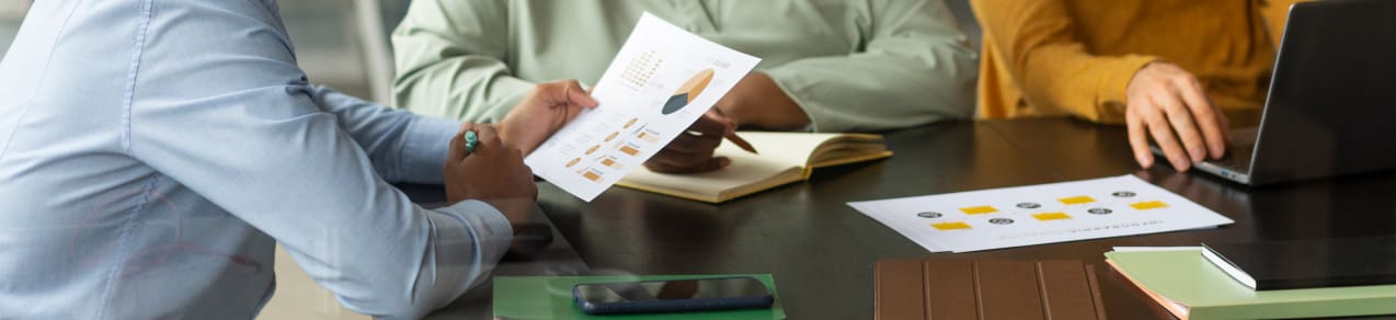 Image of leaders reviewing metrics as an example of a business that would need management liability insurance