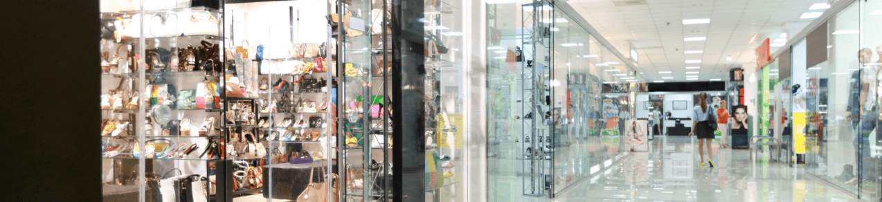 Window fronts in a shopping center showing an example of a business that could use commercial umbrella insurance.